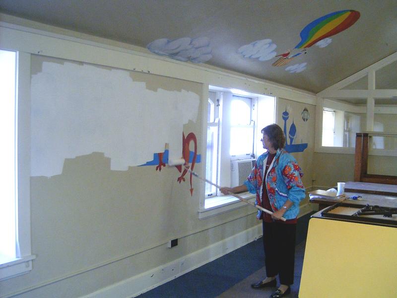 Ruby_Moon-Houldson_painting_over_the_mural_in_the_upstairs_room_that_used_to_house_the_child’s_library